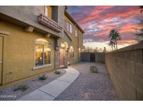Charming two-story home with a beautiful desert landscape, enhanced by a sunset backdrop at 17150 N 23Rd St # 125, Phoenix, AZ 85022