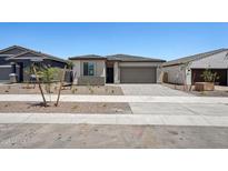 Charming single-story home featuring a two-car garage and low maintenance desert landscaping at 18248 W La Senda Dr, Surprise, AZ 85387