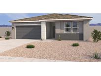 Charming single-story home features a gray exterior, a two-car garage, and low maintenance desert landscaping at 18269 W Camino De Oro --, Surprise, AZ 85387