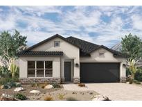 Charming single-story home with a modern design, neutral colors, dark tiled roof and a well-maintained desert landscape at 36045 N Barrel Aged Dr, San Tan Valley, AZ 85140