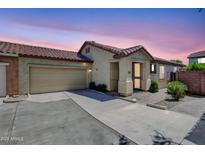 Charming single-story home featuring a tile roof and a two-car garage at sunset at 3898 E Palmer St, Gilbert, AZ 85298