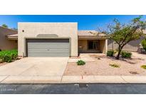 Charming single-story home featuring a two-car garage and low maintenance landscaping at 64 N 63Rd St # 25, Mesa, AZ 85205