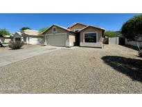 Charming single-story home with neutral stucco exterior and low-maintenance desert landscaping at 740 W Dublin St, Gilbert, AZ 85233