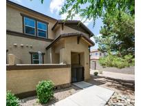 Charming front entrance featuring a private courtyard and gated access to this lovely home at 14870 W Encanto Blvd # 1059, Goodyear, AZ 85395