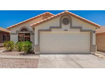 Charming single-story home with a two-car garage and well-maintained landscaping at 16827 S 20Th Way, Phoenix, AZ 85048