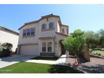 Attractive two-story stucco home with a two-car garage, manicured landscaping, and an inviting entrance at 2213 W Marconi Ave, Phoenix, AZ 85023