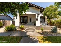 Charming single-Gathering home features a quaint front porch and well-maintained desert landscaping at 2221 N Richland St, Phoenix, AZ 85006