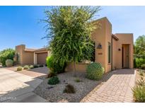 Inviting exterior view of home showcasing desert landscaping and contemporary architecture on a sunny day at 35990 N Desert Tea Dr, Queen Creek, AZ 85140