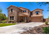 Charming two-story home featuring stone accents, a covered porch and a two car garage at 3760 W Lapenna Dr, New River, AZ 85087