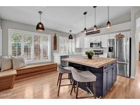 Bright kitchen with modern appliances, a center island with butcher block, and an inviting window seat at 4350 E Gatewood Dr, Phoenix, AZ 85050