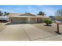 Inviting single-story home with a long driveway and low-maintenance landscaping at 1559 S Padre Rd, Apache Junction, AZ 85119