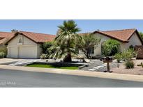 Charming single-story home featuring a tile roof, desert landscaping, and a two-car garage at 16414 S 36Th St, Phoenix, AZ 85048