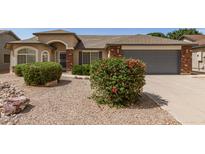 Charming single-story home featuring a low-maintenance yard, brick accents, and a two-car garage at 3646 E Rousay Dr, San Tan Valley, AZ 85140
