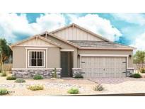 Charming single-story home featuring a two-car garage and desert landscaping at 40526 W Rio Grande Dr, Maricopa, AZ 85138
