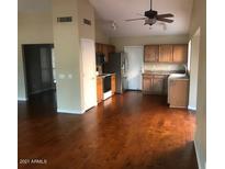Bright eat-in kitchen features stainless appliances, wood floors, and lots of natural light at 5333 W Dublin Ct, Chandler, AZ 85226