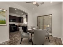 Bright dining area features modern furnishings and decor, adjacent to the kitchen and overlooking the outdoor patio at 10370 W Sands Dr # 463, Peoria, AZ 85383