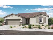 Charming single-story home featuring stone accents, a two-car garage, and desert-friendly landscaping at 14323 W Alameda Rd, Surprise, AZ 85387