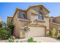Charming two-story home featuring a well-maintained yard and attached two-car garage at 1451 E South Fork Dr, Phoenix, AZ 85048