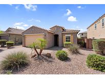 Charming single-story home features desert landscaping, a two-car garage, and a welcoming entrance at 2759 E Mews Rd, Gilbert, AZ 85298