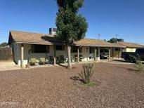 Charming single-story home with a covered porch and low maintenance desert landscaping at 5735 N 32Nd Dr, Phoenix, AZ 85017