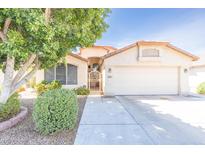 Charming single-story home features a well-maintained front yard and a two-car garage at 6415 W Escuda Rd, Glendale, AZ 85308