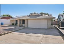 Charming single-story brick home featuring a two-car garage and a well-maintained front yard at 9641 N 36Th Dr, Phoenix, AZ 85051