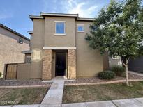 Two-story home featuring a stacked stone entry, desert landscaping, and a well maintained front yard at 1736 W Pollack St, Phoenix, AZ 85041