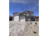 Charming two-story home with a two-car garage and paved driveway, showcasing a well-maintained facade at 18722 E Helian Dr, Gold Canyon, AZ 85118