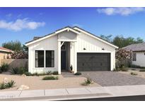 Charming single-Gathering home with gray roof, complemented by desert landscaping at 20312 W Sells Dr, Buckeye, AZ 85396