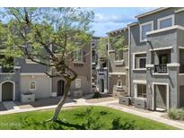 Charming townhouse community with well-maintained landscaping and inviting walkways at 2401 E Rio Salado Pkwy # 1047, Tempe, AZ 85288