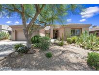 Beautiful single-story home with desert landscaping and a charming curb appeal at 33317 N 71St St, Scottsdale, AZ 85266