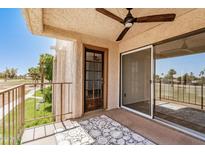 Charming patio features a ceiling fan and views of lush greenery at 7061 E Broadway Rd # 48, Mesa, AZ 85208
