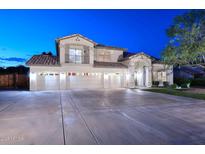Stunning two-story home featuring a five-car garage and private balcony at 8026 W Villa Lindo Dr, Peoria, AZ 85383