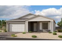 Charming single-story home featuring a two-car garage, neutral color palette, and a welcoming front porch at 11338 E Utah Ave, Mesa, AZ 85212