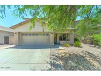Charming single-story home featuring a two-car garage and well-maintained gravel landscaping at 11633 W Jefferson St, Avondale, AZ 85323