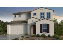 Charming two-story home featuring a neutral color palette, well-manicured landscaping, and a two car garage at 17149 W Sweet Iron Pass, Surprise, AZ 85387