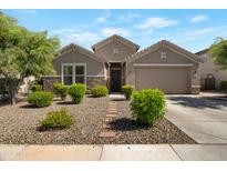 Charming home featuring a landscaped front yard and cozy exterior at 18837 W San Juan Ave, Litchfield Park, AZ 85340