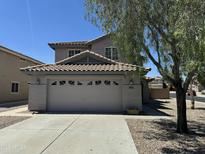 Charming two-story home featuring a tile roof and a spacious two car garage at 22632 W Solano Dr, Buckeye, AZ 85326