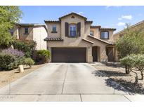 Two-story home featuring a spacious driveway, desert landscaping, and a neutral-toned stucco facade at 45722 W Barbara Ln, Maricopa, AZ 85139