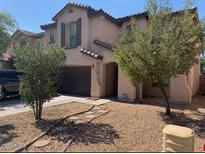 Charming two-story home with a well-maintained yard and attached garage at 45722 W Barbara Ln, Maricopa, AZ 85139