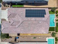 Aerial view of a home featuring a tile roof, solar panels, sparkling pool, and well-maintained landscaping at 21352 E Domingo Rd, Queen Creek, AZ 85142