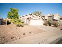 Charming single-story home featuring a low-maintenance desert landscape and spacious two-car garage at 2533 N 114Th Ave, Avondale, AZ 85392