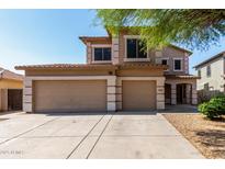 Inviting two-story home with a spacious three-car garage and well-maintained landscaping at 2918 E Silverbell Rd, San Tan Valley, AZ 85143