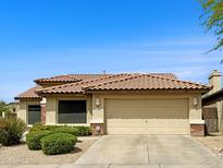 Charming single-story home featuring a tile roof, desert landscaping, and an attached two-car garage at 4208 E Hamblin Dr, Phoenix, AZ 85050