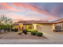 Charming single-Gathering home featuring desert landscaping and a red tile roof at sunset at 4208 E Hamblin Dr, Phoenix, AZ 85050