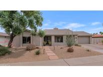 Charming home featuring desert landscaping, a stone walkway and a neutral color palette at 7806 E Via De La Entrada --, Scottsdale, AZ 85258