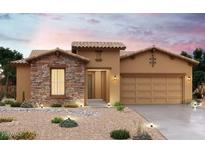 Inviting single-story home featuring stone accents, desert landscaping, and warm-toned stucco exterior at 20111 W San Miguel Ave, Litchfield Park, AZ 85340