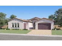 Inviting single-story home with arched windows, a paver driveway, and a 2-car garage providing great curb appeal at 25162 N 177Th Dr, Surprise, AZ 85387