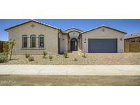 Charming single-story home with a well-manicured front yard, desert landscaping and a two car garage at 25162 N 177Th Dr, Surprise, AZ 85387