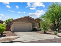 Charming single-story home featuring a well-maintained front yard and a two-car garage at 35414 N 32Nd Dr, Phoenix, AZ 85086